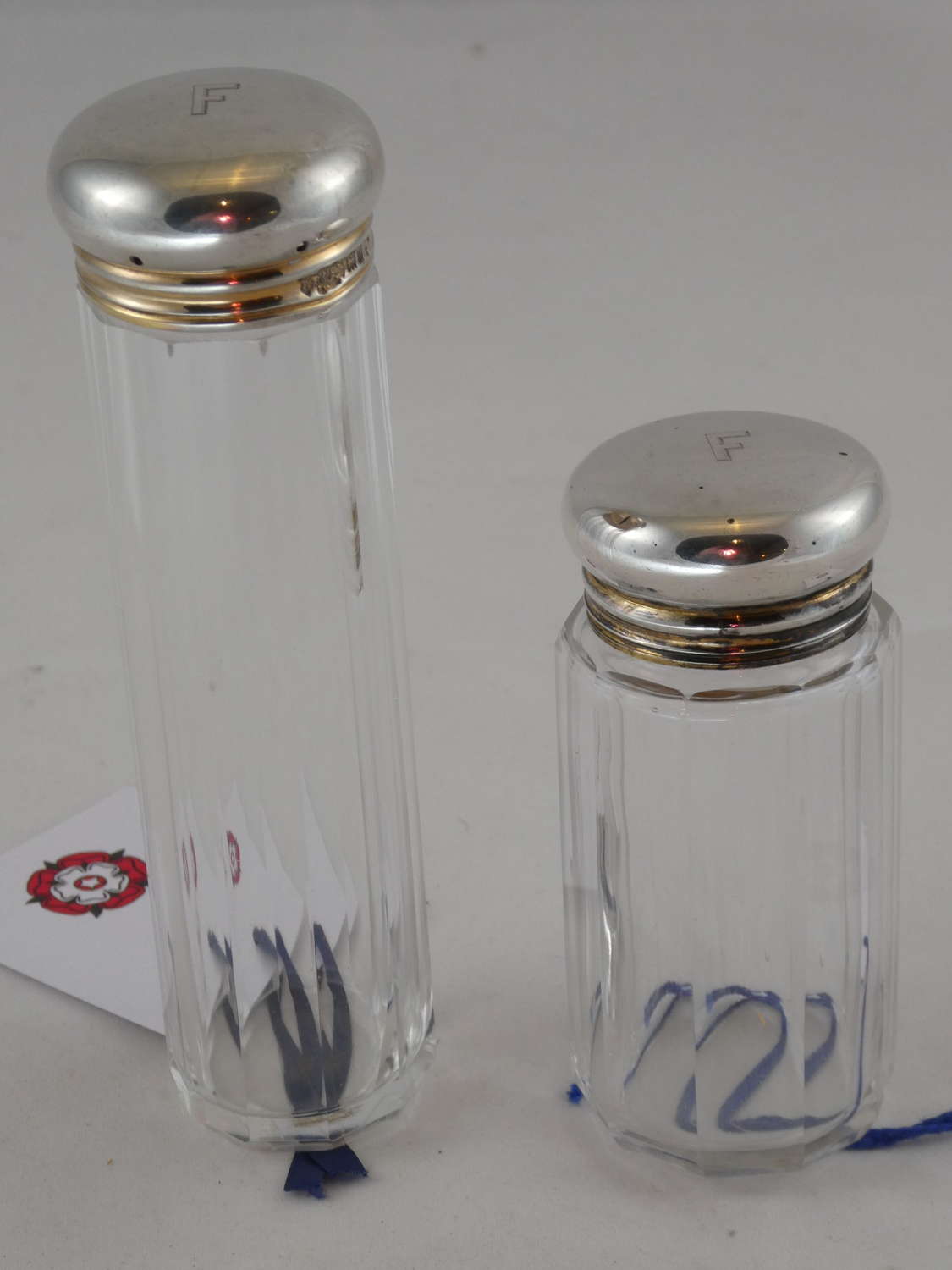 Two Silver Topped Bottles